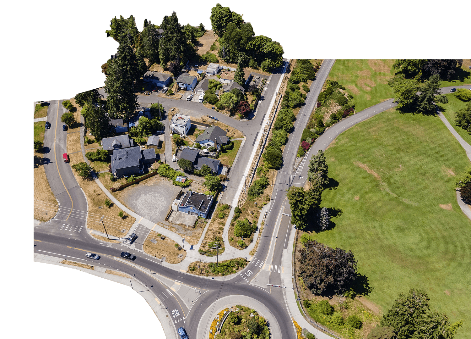 Aerial of Point Defiance Park round a bout and neighboring homes.