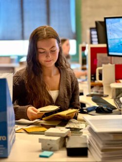 BCRA Intern Gabriella Pearson studies various fabric samples